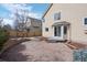 Backyard featuring a stone patio, landscaping and sliding glass doors at 15028 Clayton St, Thornton, CO 80602