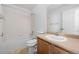 A full bathroom with combined shower-tub and single sink vanity with light brown cabinets at 15028 Clayton St, Thornton, CO 80602