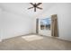Spacious bedroom boasts a vaulted ceiling, ceiling fan, and large window for natural light at 15028 Clayton St, Thornton, CO 80602