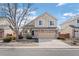 Charming two-story home with neutral siding, stone accents, and a well-maintained front yard at 15028 Clayton St, Thornton, CO 80602