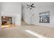 Bright and open living area with hardwood floors, a staircase, and multiple windows at 15028 Clayton St, Thornton, CO 80602