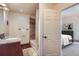 Well-lit bathroom with granite vanity, tiled floors, and shower-tub combination at 11876 Coal Creek Heights Dr, Golden, CO 80403
