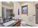 Well-lit bathroom with granite countertop, modern fixtures, and decorative tile accents at 11876 Coal Creek Heights Dr, Golden, CO 80403