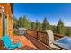 Relax on this spacious deck with a grill and scenic views of the surrounding forest at 11876 Coal Creek Heights Dr, Golden, CO 80403