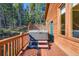 Private outdoor hot tub nestled on a wooden deck, perfect for relaxation at 11876 Coal Creek Heights Dr, Golden, CO 80403