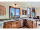 Bright kitchen featuring granite countertops, stainless steel appliances, and a scenic mountain view at 11876 Coal Creek Heights Dr, Golden, CO 80403