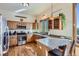 Well-lit kitchen with granite counters, stainless appliances, and custom wood cabinetry at 11876 Coal Creek Heights Dr, Golden, CO 80403