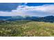 Panoramic aerial view of scenic mountains, lush forests, and sprawling landscape at 11876 Coal Creek Heights Dr, Golden, CO 80403