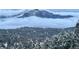 Panoramic view of snow covered trees and snow covered mountains at 11876 Coal Creek Heights Dr, Golden, CO 80403