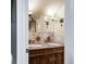 Bathroom features a dual sink vanity with granite countertop and a large framed mirror at 120 Cherokee St, Denver, CO 80223