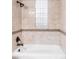 Bathroom with tiled shower and a tiled accent border at 120 Cherokee St, Denver, CO 80223