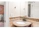 Bathroom featuring a granite vanity and a decorative mirror at 120 Cherokee St, Denver, CO 80223