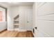 Bedroom featuring hardwood floors, built in shelving and a window with brick exposure at 120 Cherokee St, Denver, CO 80223
