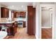 Kitchen with stainless steel appliances, brown cabinets, and wood flooring at 120 Cherokee St, Denver, CO 80223