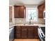 Modern kitchen design showcasing a stainless steel sink, granite countertops, and dark cabinetry at 120 Cherokee St, Denver, CO 80223