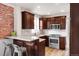 Modern kitchen with stainless steel appliances, marble countertops, and dark wood cabinetry at 120 Cherokee St, Denver, CO 80223