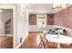 Living room showcasing exposed brick wall, hardwood floors, and stylish decor at 120 Cherokee St, Denver, CO 80223