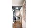 Staircase with gray walls, carpeted steps, and brick accents at 120 Cherokee St, Denver, CO 80223