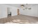 Spacious bedroom features wood floors, a modern ceiling fan, and natural light from multiple windows at 375 S University Blvd, Denver, CO 80209