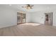 Bedroom featuring sleek wood floors, a ceiling fan, and sliding doors to the balcony at 375 S University Blvd, Denver, CO 80209