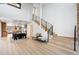 Grand foyer with hardwood floors, staircase, and plenty of natural light at 375 S University Blvd, Denver, CO 80209