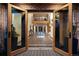 Grand foyer featuring a compass inlay, brick accent walls and an upper-level view at 375 S University Blvd, Denver, CO 80209