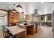 Beautiful kitchen with custom cabinets, brick accents, and stainless steel appliances at 375 S University Blvd, Denver, CO 80209