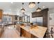 A stylish kitchen featuring granite countertops, stainless steel appliances and wood cabinets at 375 S University Blvd, Denver, CO 80209