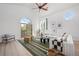 Bright living room featuring vaulted ceilings, large windows, and a cozy seating area at 375 S University Blvd, Denver, CO 80209