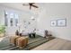 Beautifully staged living room with vaulted ceilings, unique windows, and modern decor at 375 S University Blvd, Denver, CO 80209