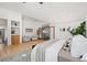 Large main bedroom with access to upper landing featuring built-ins, natural light, and neutral colors at 375 S University Blvd, Denver, CO 80209