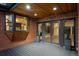 Covered patio with brick accents and direct access to home through glass doors and a pass-through window to kitchen at 375 S University Blvd, Denver, CO 80209