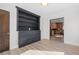 Bright room featuring custom built-in cabinets, hardwood floors, and natural light at 375 S University Blvd, Denver, CO 80209