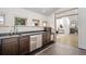 Upper landing wet bar featuring stainless steel appliances, plenty of storage, and lots of light at 375 S University Blvd, Denver, CO 80209