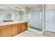 Contemporary bathroom boasts double vanity, a glass shower, and modern fixtures at 3994 Breakcamp Ct, Castle Rock, CO 80108