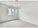 Clean bedroom features neutral carpet, two windows offering ample natural light at 3994 Breakcamp Ct, Castle Rock, CO 80108