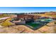 Aerial view of a modern clubhouse, featuring community amenities like a pool and outdoor lounge areas at 3994 Breakcamp Ct, Castle Rock, CO 80108