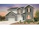 Charming two-story home with a three-car garage and beautiful landscaping at 3994 Breakcamp Ct, Castle Rock, CO 80108