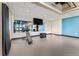 Spacious gym with mirrors, TV, and workout equipment at 3994 Breakcamp Ct, Castle Rock, CO 80108