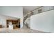 Open-concept living room and kitchen with staircase and second-floor balcony at 3994 Breakcamp Ct, Castle Rock, CO 80108