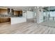 Living space with open kitchen design, featuring a large island, modern appliances, and sliding doors to an outdoor area at 3994 Breakcamp Ct, Castle Rock, CO 80108