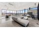 Spacious lounge area with modern seating, fireplace, TV, and expansive windows at 3994 Breakcamp Ct, Castle Rock, CO 80108