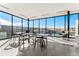 Bright lounge area with expansive windows, offering abundant natural light and scenic views at 3994 Breakcamp Ct, Castle Rock, CO 80108
