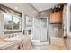 Bathroom with a shower, custom sink, and tiled floors at 1185 W 140Th Dr, Westminster, CO 80023