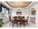 Elegant dining room with a decorative ceiling, chandelier, and ample natural light at 1185 W 140Th Dr, Westminster, CO 80023