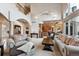 Spacious living room featuring high ceilings, arched doorways, and an open floor plan at 1185 W 140Th Dr, Westminster, CO 80023