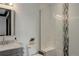 Contemporary bathroom with glass enclosed shower, sleek vanity, and modern fixtures at 6111 Huron Pl, Castle Rock, CO 80108