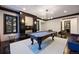 Bright game room showcases a pool table and stylish fireplace feature wall at 6111 Huron Pl, Castle Rock, CO 80108