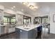 Spacious kitchen with a large center island, modern appliances, and beautiful cabinetry at 6111 Huron Pl, Castle Rock, CO 80108
