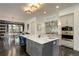 Spacious kitchen with a large center island, modern appliances, and beautiful cabinetry at 6111 Huron Pl, Castle Rock, CO 80108